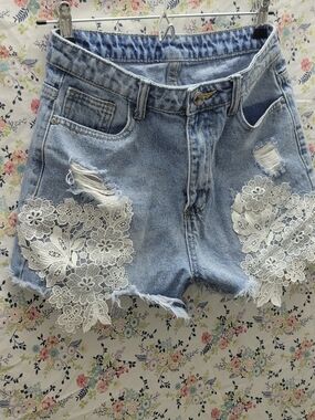 High-Waist Light Blue Denim Shorts with White Lace Appliqué